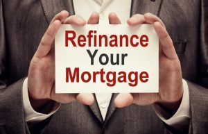 Man with a refinance information on his hands