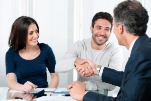 Man and woman bought health insurance with their agent Man and woman bought health insurance with their agent