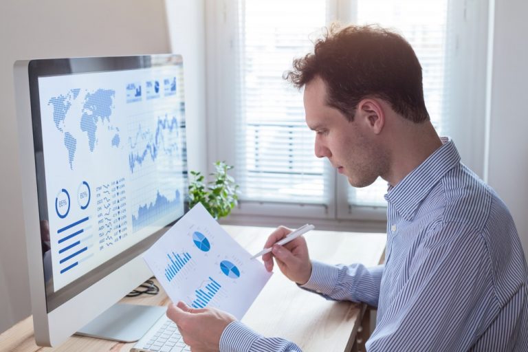 Businessman studying the status of the business