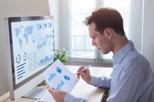 Businessman studying the status of the business Businessman studying the status of the business