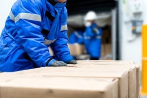 Man checking boxes in warehouse Man checking boxes in warehouse