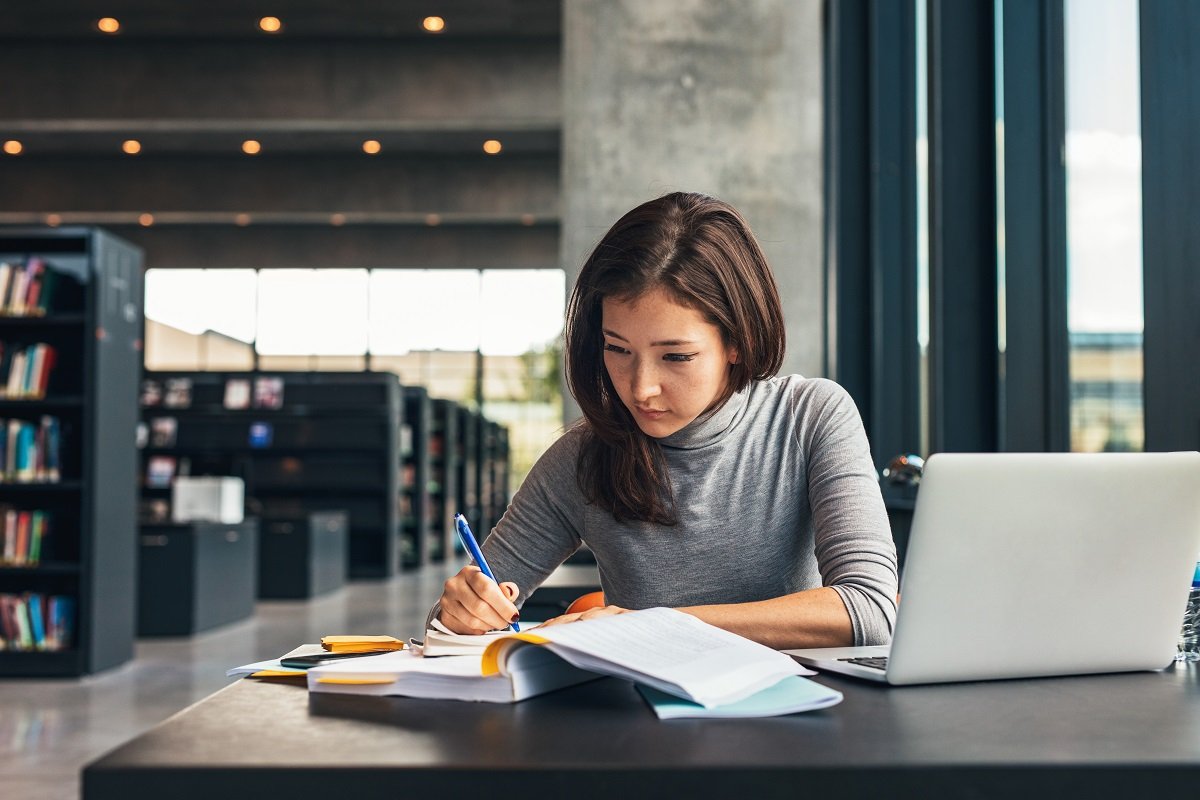 woman working and reading notes